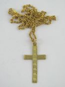 A 9ct gold crucifix having engine turned engraving upon, stamped 9ct,