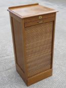 A Tambor fronted cabinet opening to reveal drawers within, 48 x 42 x 103cm.