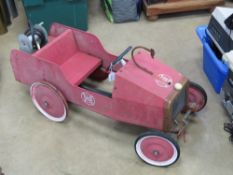 A vintage 'fire engine' pedal car having FD emblem upon, in unrestored condition,
