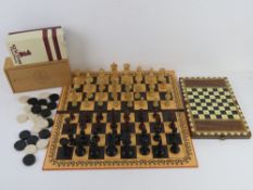 A vintage Staunton chess set in original box togther with a quantity of vintage draughts,