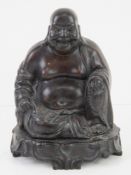 A heavy bronzed Buddha figurine approx 19cm high.