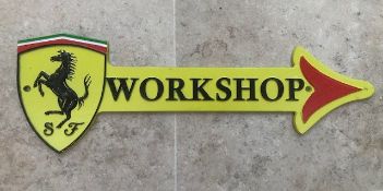 A contemporary Ferrari-themed 'Workshop' arrow sign in the colours of the City of Modena. 44cm dia.