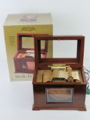 A gold label collection music box playing fifteen Christmas Carols in the Player piano principle,