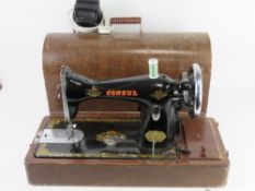 A vintage sewing machine marked Consul, in case.