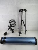 A Sky-Watcher telescope with tripod.