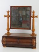 A toilet mirror having shaped jewellery drawer to base,