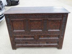 A fine 18th century or earlier inlaid oak mule or marriage chest,
