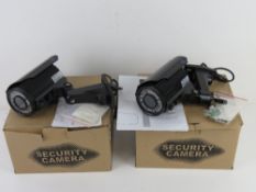 A pair of 'weather proof day and night IR colour' security cameras, each in original packaging,