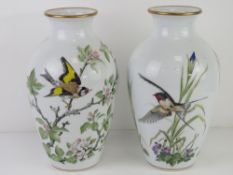A pair of Franklin Porcelain vases being Woodland Bird and Meadowland Bird,