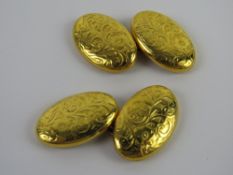 A pair of early 20thC 15ct gold cufflinks having floral engraving upon, hallmarked Birmingham, 5.5g.