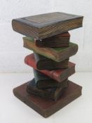 An occasional table in the form of a stack of books. 52.5cm high.