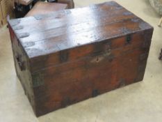 An antique tin lined trunk having metal corner bracing and end handles measuring approx 91 x 55 x
