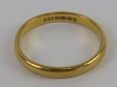A 22ct gold band hallmarked for Birmingham, size L, 2.5g.