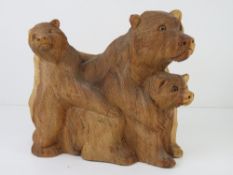 A Balinese hand carved mother bear with babies standing 22cm high.