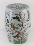 A contemporary ceramic seat in famille rose design, 46cm high.