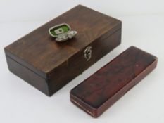 A vintage Japanese style lacquered pen box having cherry blossom design upon together with a