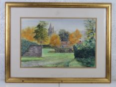 Watercolour; farm yard with red brick wall, church steeple beyond, framed and glazed.