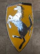 A large and impressive cast aluminium Ferrari-themed wall sign featuring the Cavallino Rampante.