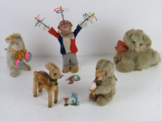 Five mid century clockwork toys inc cat music box, bunny rabbit with maracas, juggling clown (a/f),
