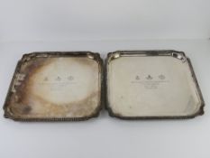A matched pair of silver plated square shaped presentation salvers each inscribed 299 (R.B.Y., Q.O.
