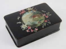 A delightful papier mache patchbox having Swiss lake and mountain scene upon measuring 9.3 x 6.