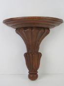 A hand carved wooden plinth.