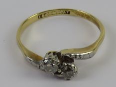 A two stone diamond ring in 18ct gold and platinum, each round cut stone approx 3.2mm dia x 2.2mm.