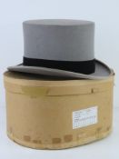 A felt mourning hat by Tress and Co, with original paper box, size 7 1/4.