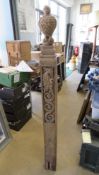 An antique carved oak newel post having a well carved bird upon, 150cm in length.