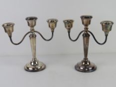 A pair of HM silver three sconce candelabra bearing presentation inscription dated 1972,