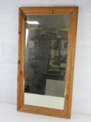 A vintage pine framed mirror having good quality heavy glass within and measuring 50 x 94cm.