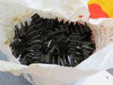 Thirty MG53/MG42 belt links.