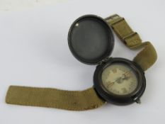 A WWII SOE jump wrist compass with strap