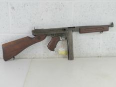 A deactivated Thompson M1A1 SMG with lat