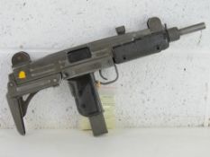 A deactivated Uzi 9mm Sub Machine Gun. L