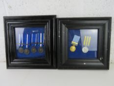 Two framed 20thC medal set reproductions