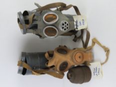 A WWII French Gas mask and tin, together