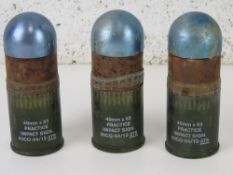 Three inert 40mm x 53 practice grenades.