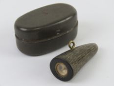 A WWII SOE Jacket toggle compass in tin.