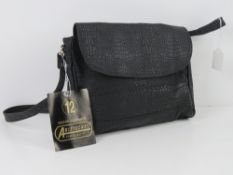 An 'as new' black faux reptile skin handbag 25 x 22cm.
