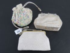 Three evening bags, one being beaded drawstring.