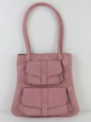 A baby pink handbag having double pocket design to front approx 31cm wide.