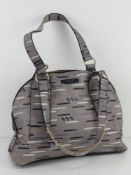 Radley; a grey and navy patterned leather handbag, some scuffs noted to corners, 34cm wide.