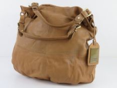A tan leather tote bag by Linia Weekend, mark noted to back, approx 38cm wide.