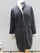 An 80% wool ladies coat in black with grey border, size 12, approx measurements; 40