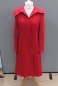 A 22% wool red coat size 14, approx measurements; 38