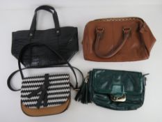 A quantity of handbags inc Next, green clutch bag and cross body bag. Four items.
