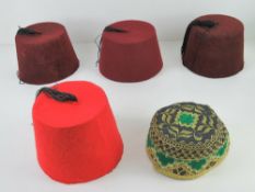 Four vintage fez hats. Together with another embroidered cap.