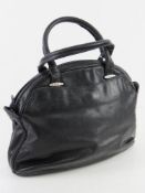 An Italian made vintage navy leather handbag approx 31cm wide.