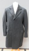 A pure new wool felted coat made by Crombie Aberdeen, Scotland in black,